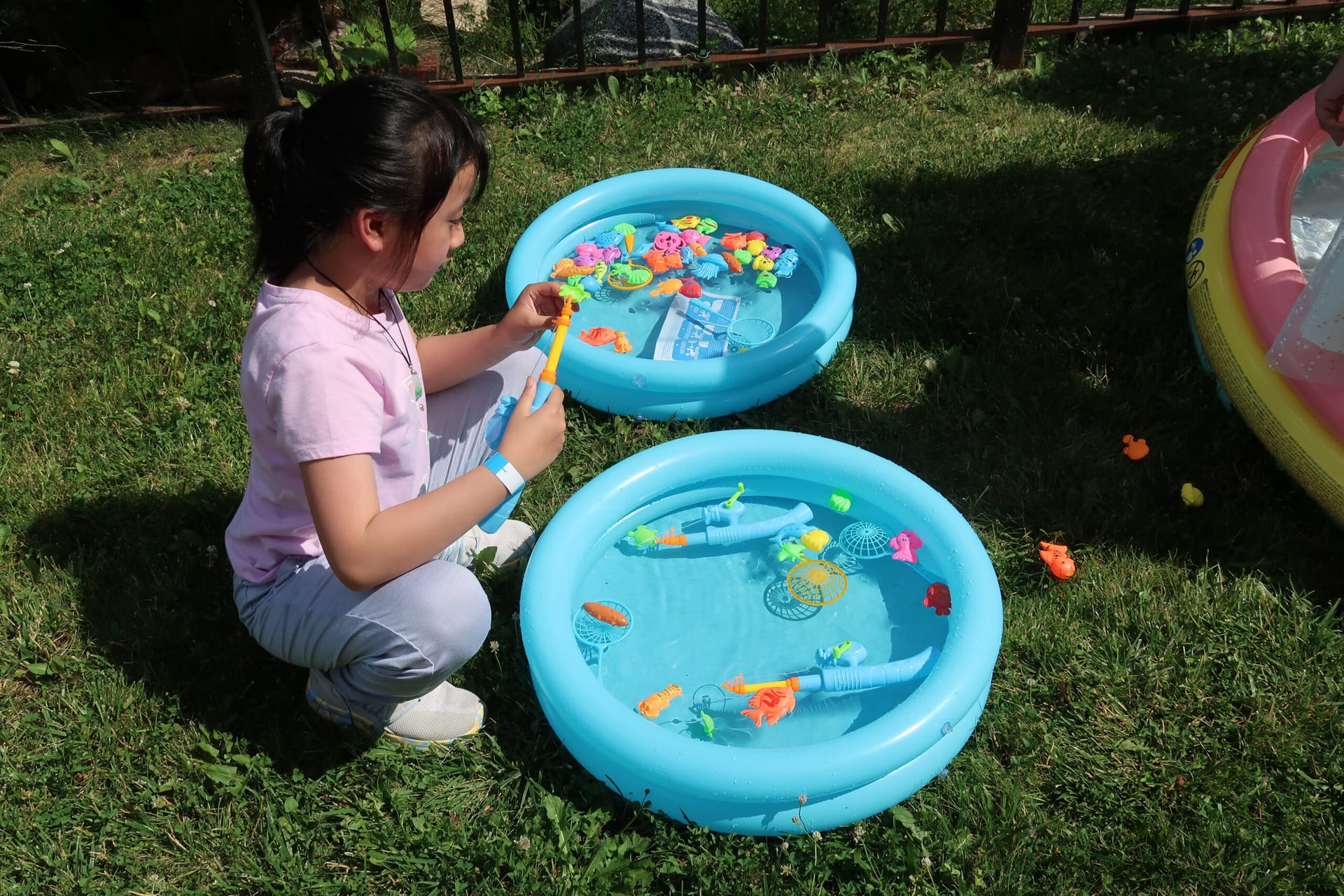 CASL Block Party - Child plays with pool toys